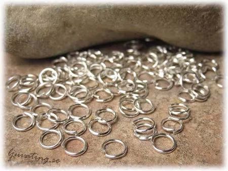 Silverfärgade bindringar 50-pack ca 5 mm