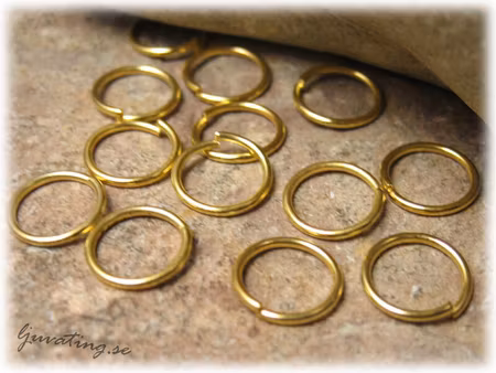 Matt guldfärgade bindringar 50-pack ca 8 mm