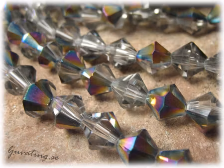 Facetterad bicone black diamond AB 10-pack ca 8 mm