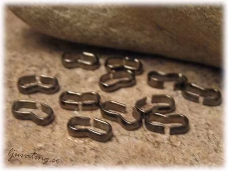 20-Pack mindre klämma nyans hematitsvart ca 8x4 mm