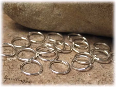 Bindringar silverfärgade 50-pack ca 7 mm