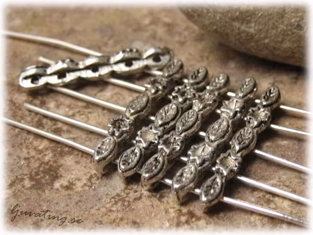 Avdelare 5-hålsdelare med motiv ca 23x3 mm