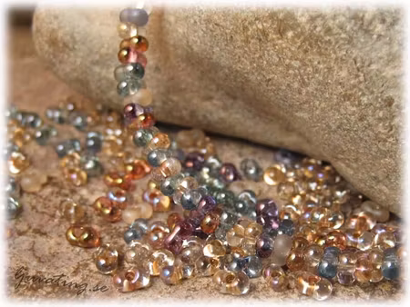 Mix lila/topaz/grön farfalle pärla ca 4x2 mm