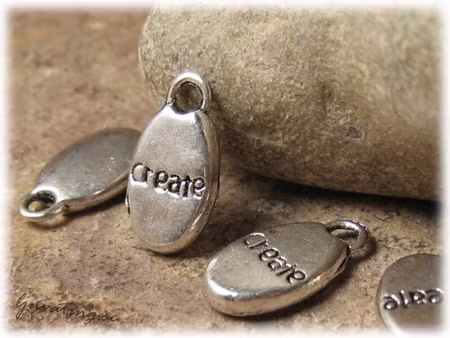 Berlock i metall text Create ca 15x8 mm