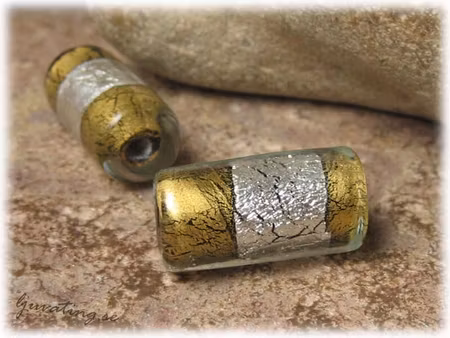 Avlång rund guldfoil och silverfoil ca 22x10 mm