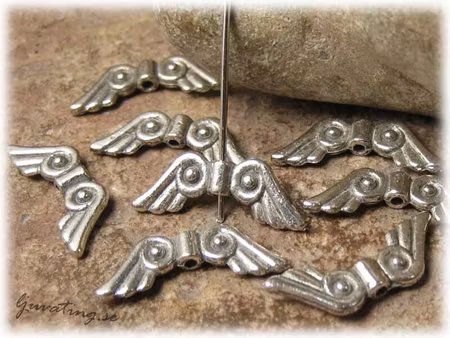 Vinge silverfärgad metall ca 20x7,5 mm