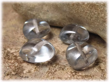 Transparent ljus gråblå glaspärla ca 12x10 mm