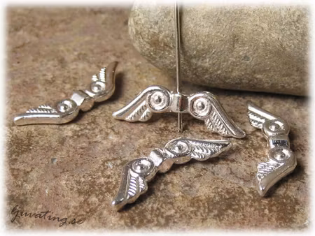 Vinge ljus silverfärgad med öga ca 24x7 mm