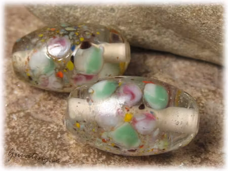 Transp clear oval pärla med blommor ca 23x14mm