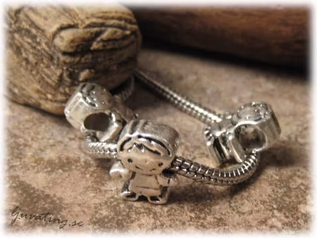 Ormlänkspärla i metall pojke ca 14x12 mm