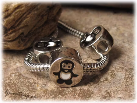 Ormlänkspärla med pingvin ca 11 mm i diameter