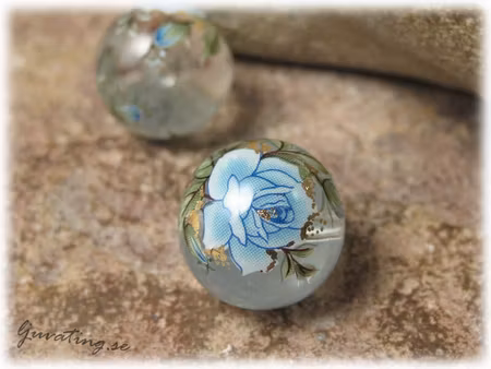 Rund Tensha clear transp med blå ros ca 14 mm