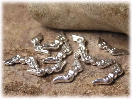 Vinge liten med ''öga'' ljus silverfärgad ca16x6mm