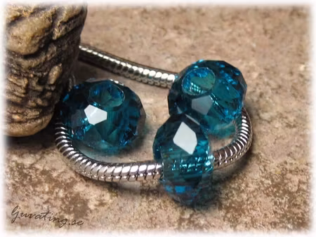 Ormlänkspärla blå facetterad glaspärla ca 14x8 mm