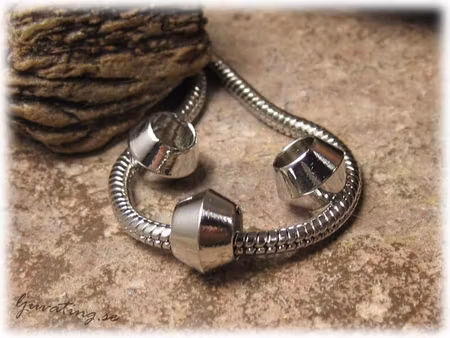Ormlänkspärla rondell i metall ca 10x7 mm