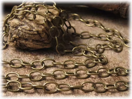 Kedja bronsfärgad korsade ovaler ca 8x6 mm