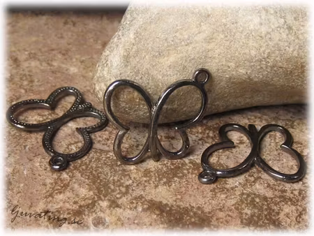 Berlock svart fjäril i metall 4-pack ca 17x19 mm