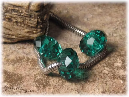 Ormlänkspärla petrol facetterad glaspärla ca14x8mm