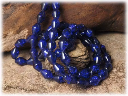 1 sträng krackelerade blålila bicone ca 10x7 mm