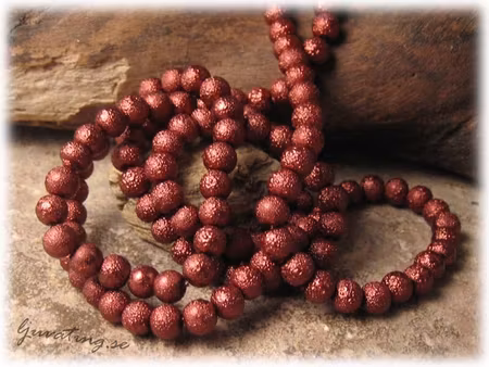 1 sträng kopparbrun rund ispärla ca 6 mm