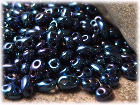 Twin beads jet iris blå ca 2,5x5 mm