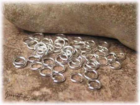 Silverfärgade bindringar 50-pack ca 5 mm