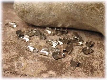 Riktigt små platinafärgade avslut 10-Pack ca 5x3mm