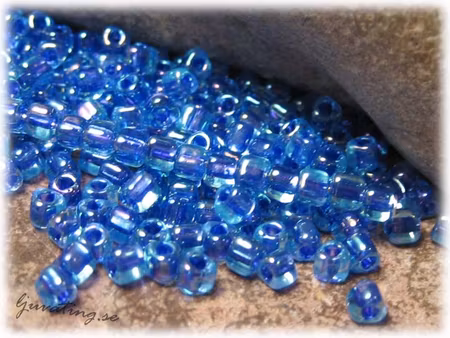 Miyuki triangel fancy lilac rainbow 8/0