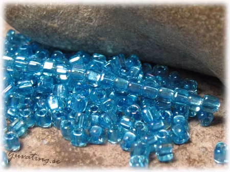 Miyuki triangel aquamarine rainbow 8/0