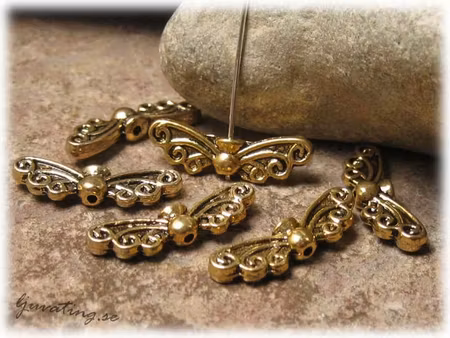 Vinge med snirklar till ängel i antikguld ca22x7mm