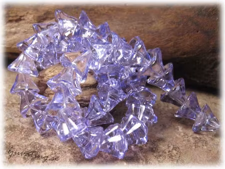1 sträng lila änglakjol ca 10 x 12 mm