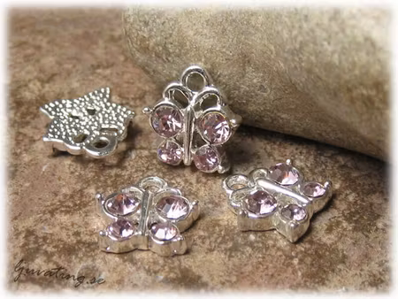 Berlock bling fjäril med rosa strass ca 13x12 mm