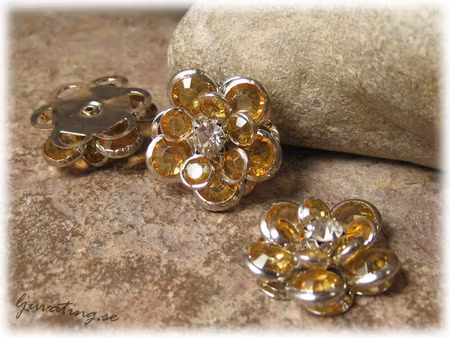 Blomma connector med lejongul strass 18 mm