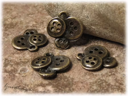 Berlock knappar i metall bronsfärgad ca 14x14 mm
