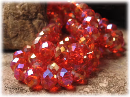 Röd AB glasfasetter rondell sträng ca 8x6 mm