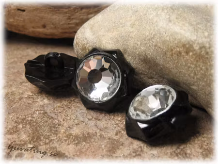Knapp i syntet clear och svart åttakantig ca 20 mm