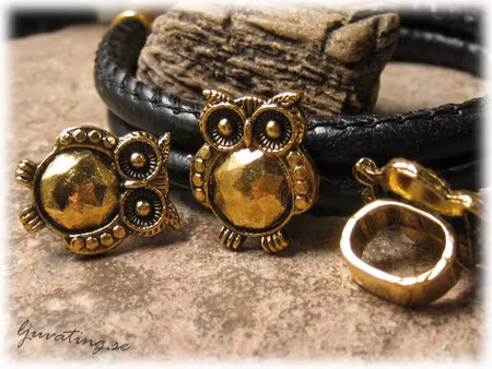 Slider uggla guldfärgad metall stort hål ca 10x7mm