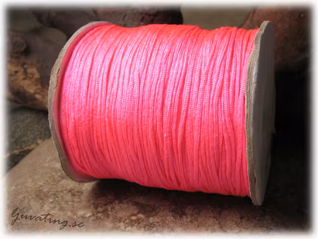 Vaxad tråd neonrosa tjocklek ca 1,5 mm