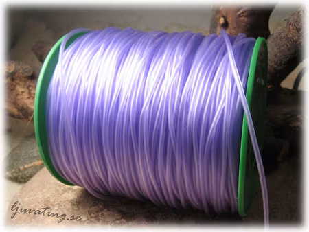 Gummislang rund ihålig transparent lila tjocklek ca 2mm