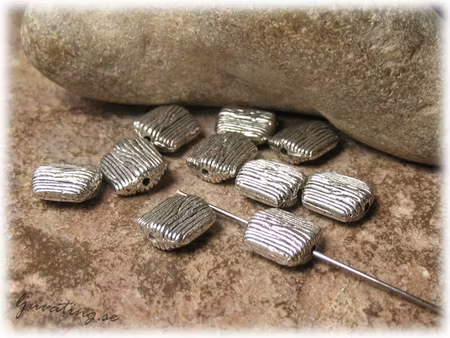 Räfflad rektangel i metall 10-pack ca 10x9 mm