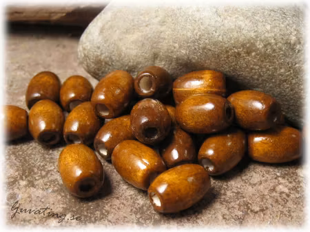 Ovala bruna träpärlor 50-pack ca 12x8 mm