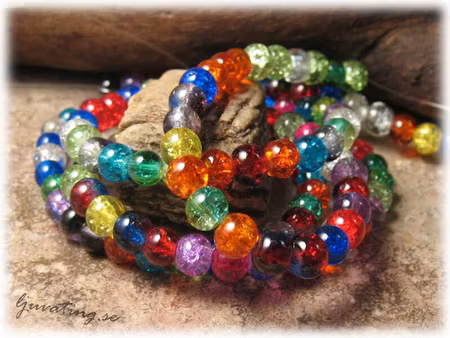 Krackade glaspärlor mixade 1 sträng ca 6 mm