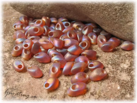 Long Magatamas frostad mörk topaz AB 4x7 mm