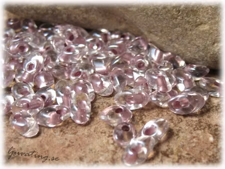 Long Magatamas orchid lined crystal 4x7 mm