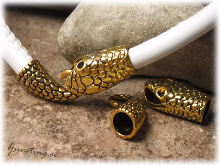 Guldfärgat ormlås i metall hål ca 6 mm