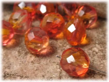 Firepolished facetterad rund fire opal ca 10 mm