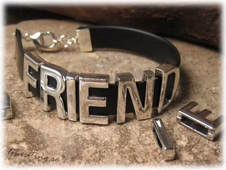 Sliders med ordet FRIEND i metall hål ca 10x2 mm