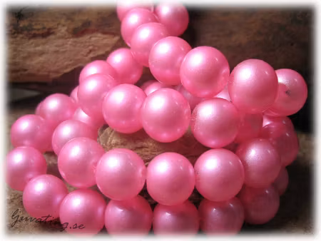 Vaxad rund rosa glaspärla 10-pack ca 12 mm