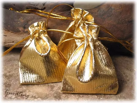 Smyckepåse liten glittrig guld ca 7x5 cm