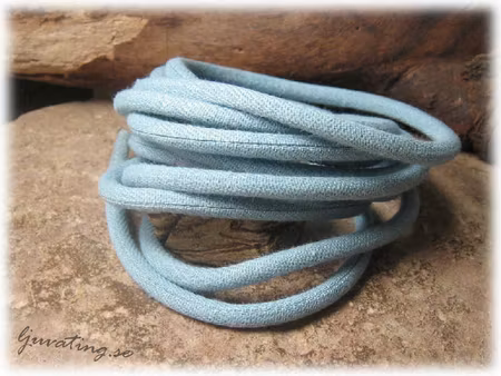 Vävt textilband runt ljusblått tjocklek ca 4 mm